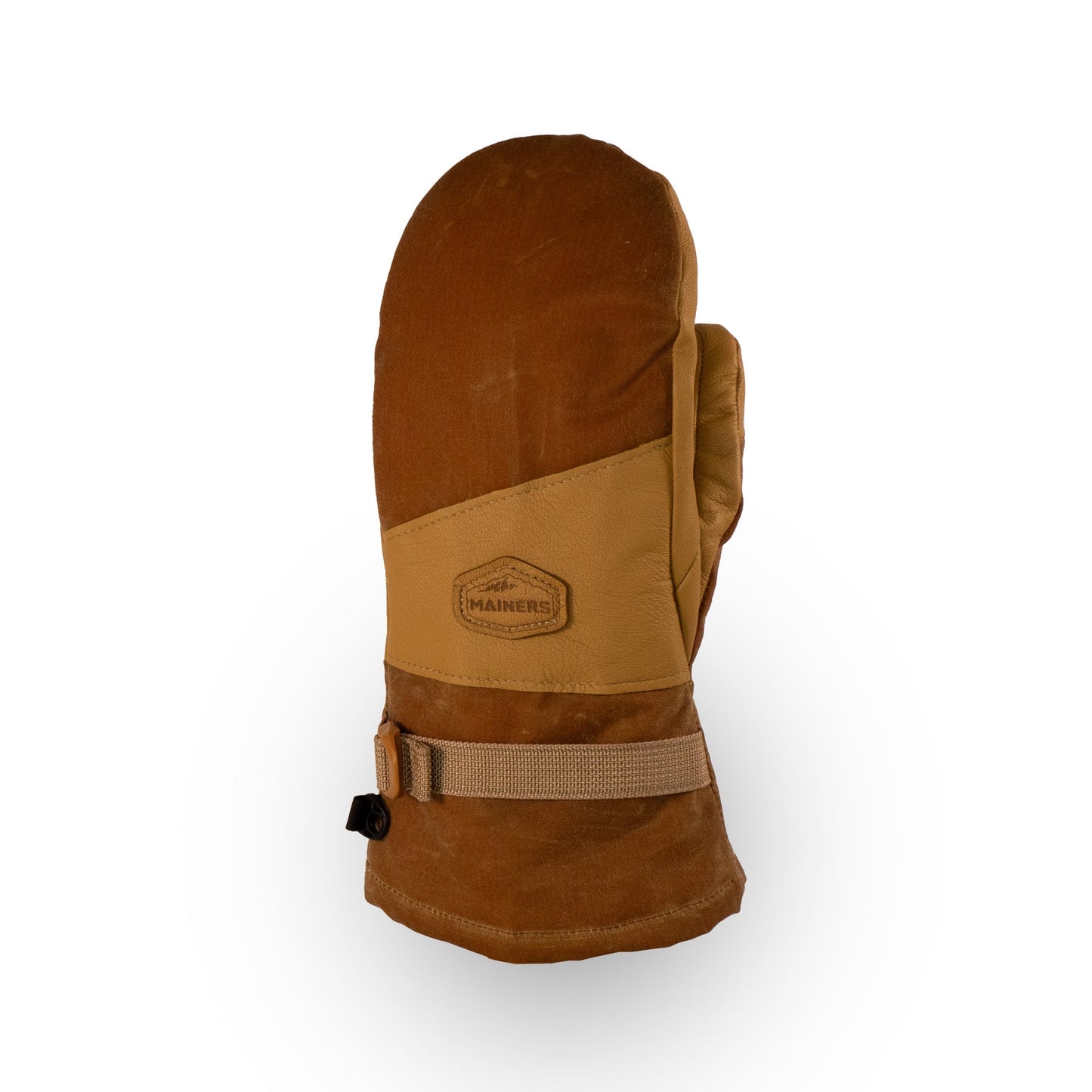 The Acadia Mitts by Mainers showcase a stylish brown and tan design, complemented by a buckle strap and a hexagonal logo patch on the back. They provide warmth and comfort, with their waxed canvas construction ensuring exceptional durability.