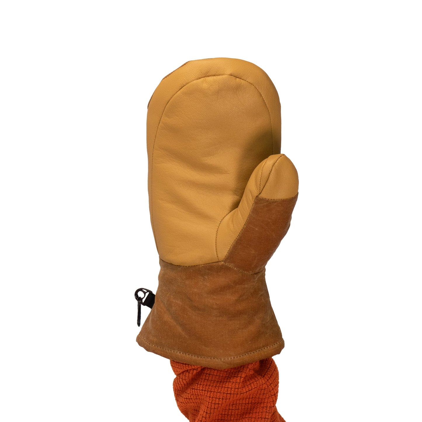 The Acadia Mitts by Mainers, made from tan leather and featuring a zippered cuff, provide excellent warmth and comfort. Their waxed canvas detailing stands out stylishly against a plain background, adding both elegance and practicality.