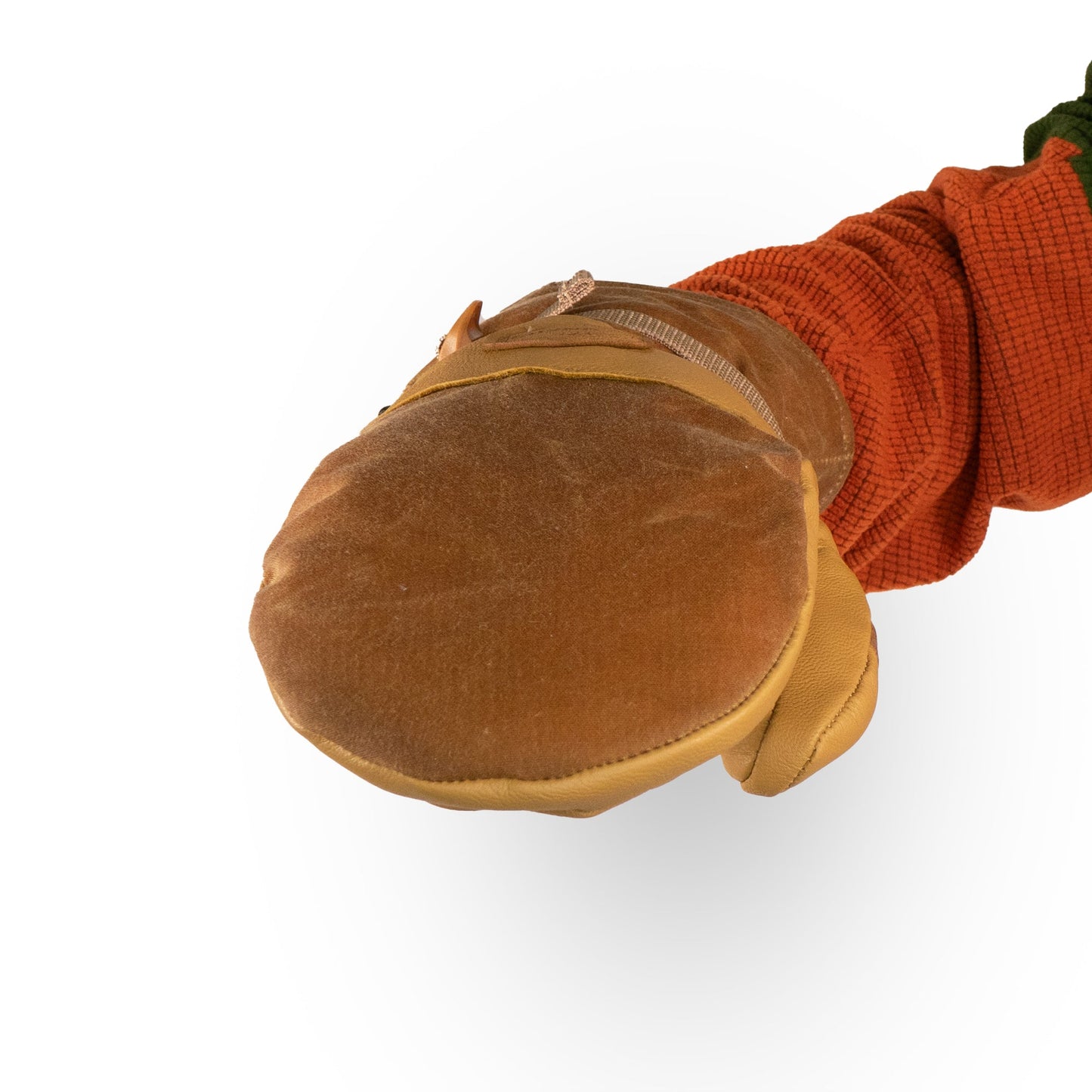 Close-up of a person extending a hand forward, showcasing the warm embrace of Mainers' Acadia Mitts complementing an orange sleeve.