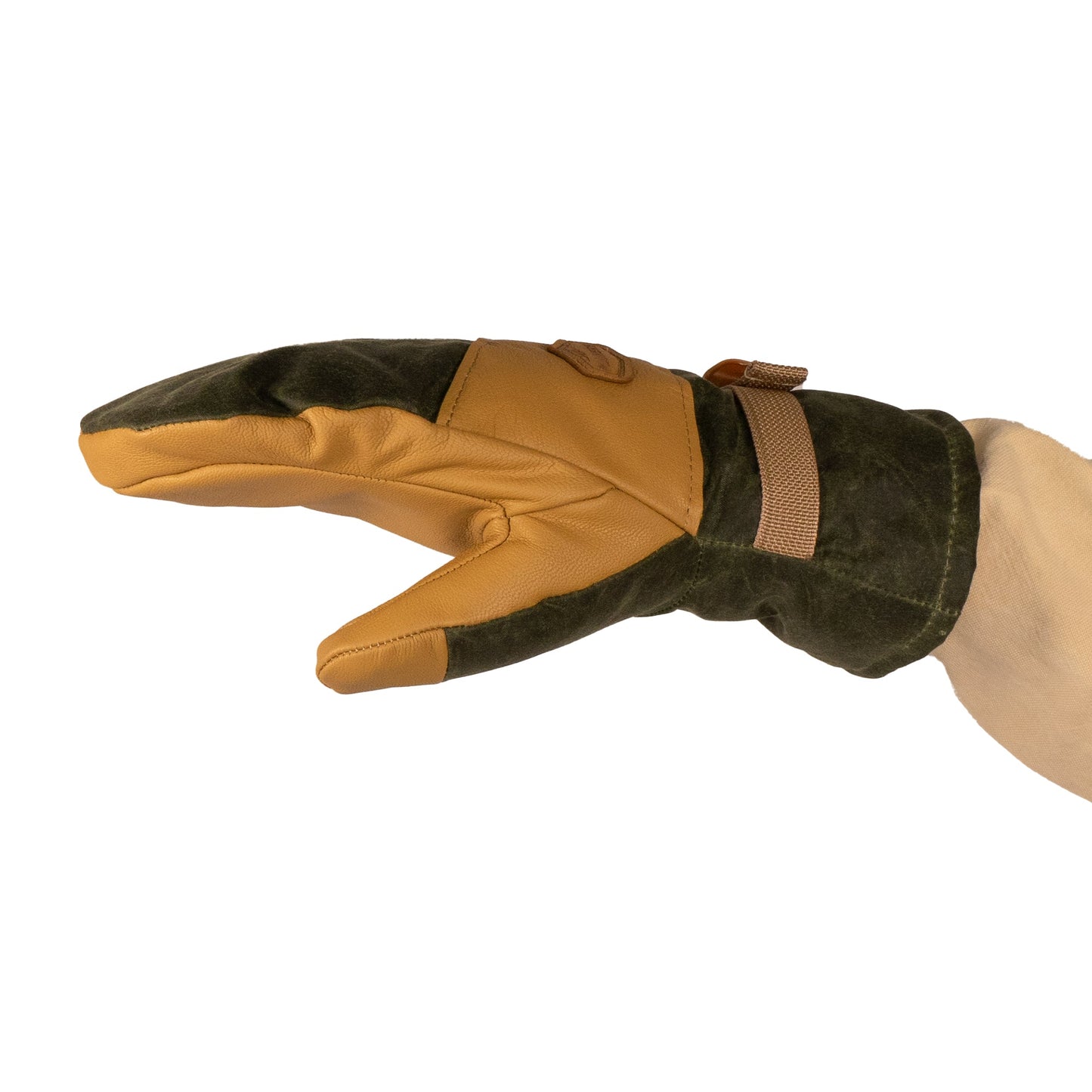 A hand wearing Mainers' Acadia Mitts, designed with durable waxed canvas in green and tan, featuring reinforced stitching and a wrist strap for enhanced warmth and comfort.