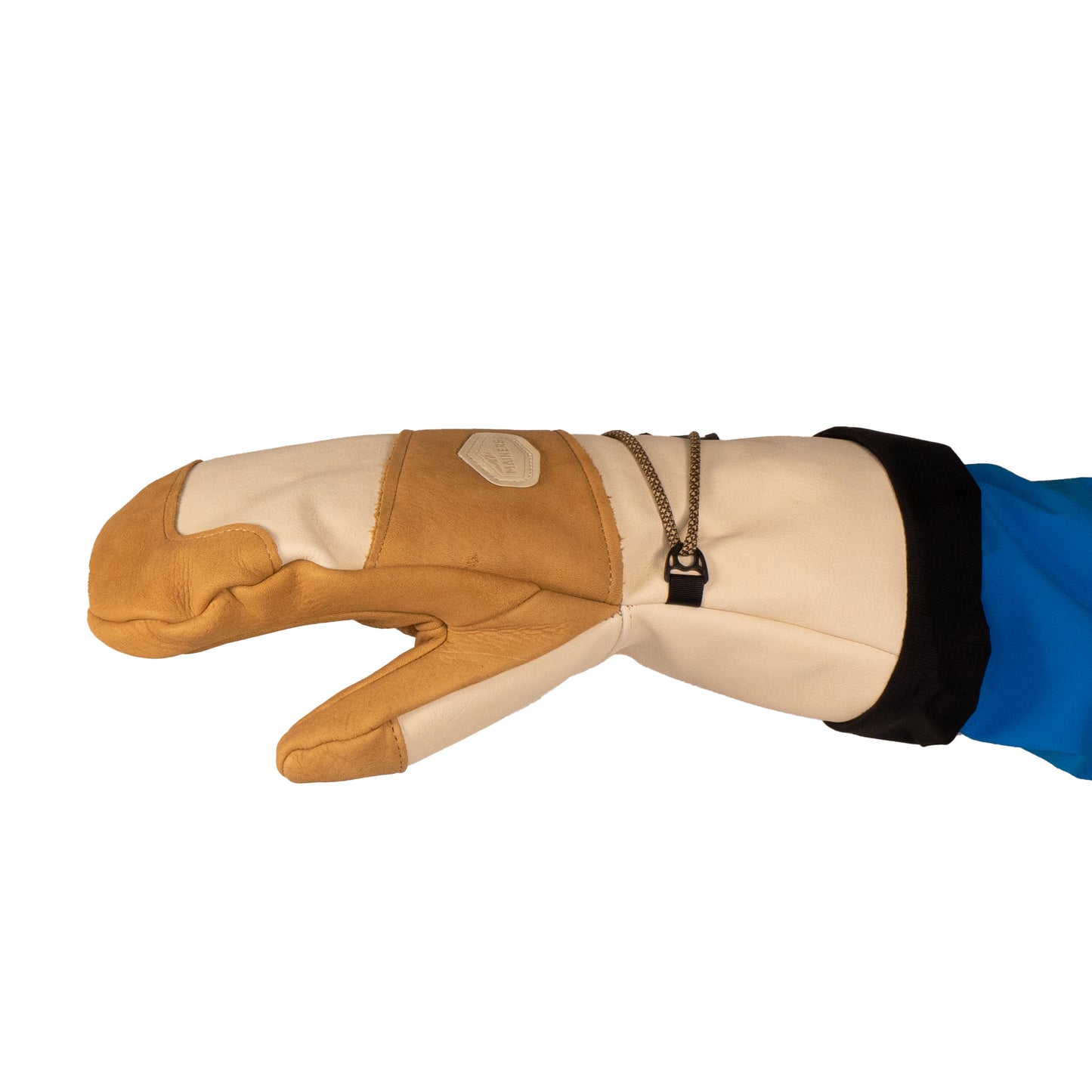 The Mainers Caribou Mitts exemplify exceptional craftsmanship, featuring a beige and brown pattern complemented by a black cuff and blue sleeve. A zipper detail on the back not only elevates their style but also boosts warmth, making them ideal for chilly days.