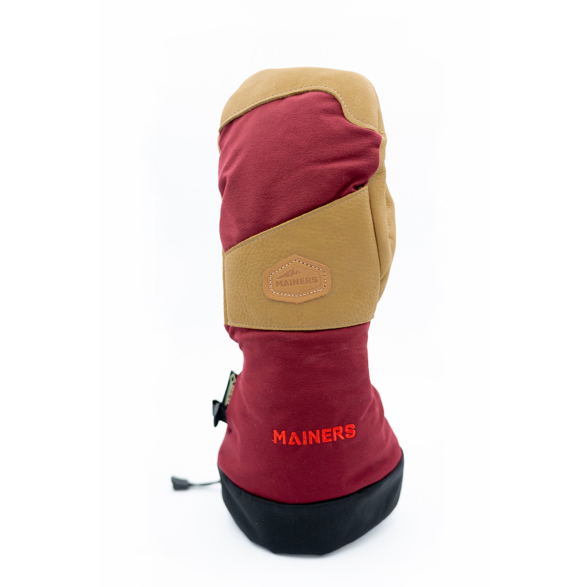 A red and tan Mainers Mitts with the word manida on it, known for its durability.