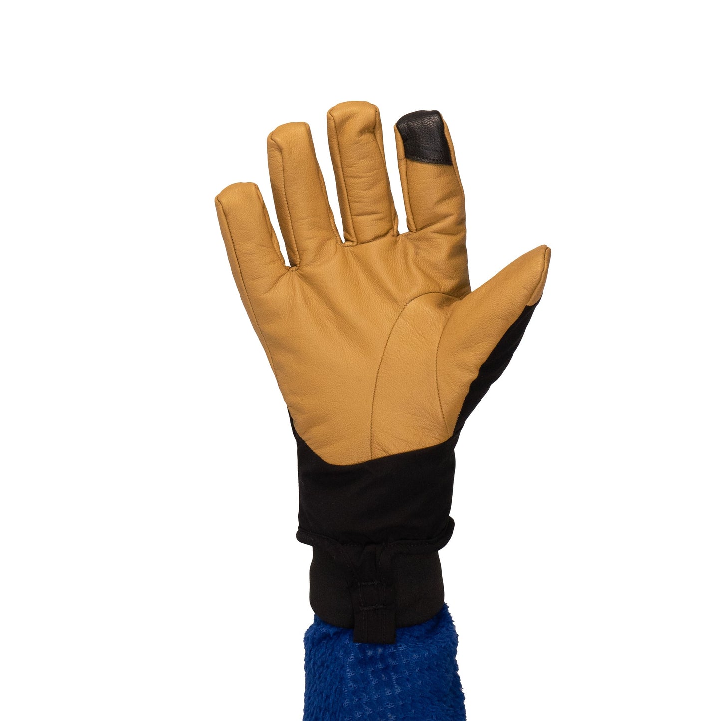 A raised hand is adorned with the Mainers Loaf Glove, providing warmth and protection with its tan and black design highlighted by a blue cuff, all set against a plain white background.