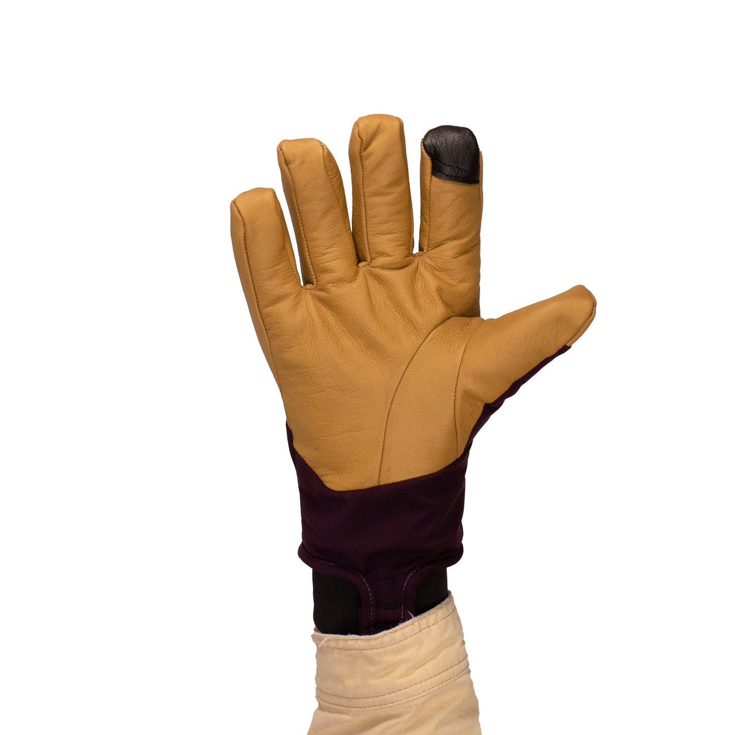 A raised hand wears the discontinued Mainers Loaf Glove in Purple/Sand, featuring a water-resistant leather palm and black material on the index fingertip, set against a white background.