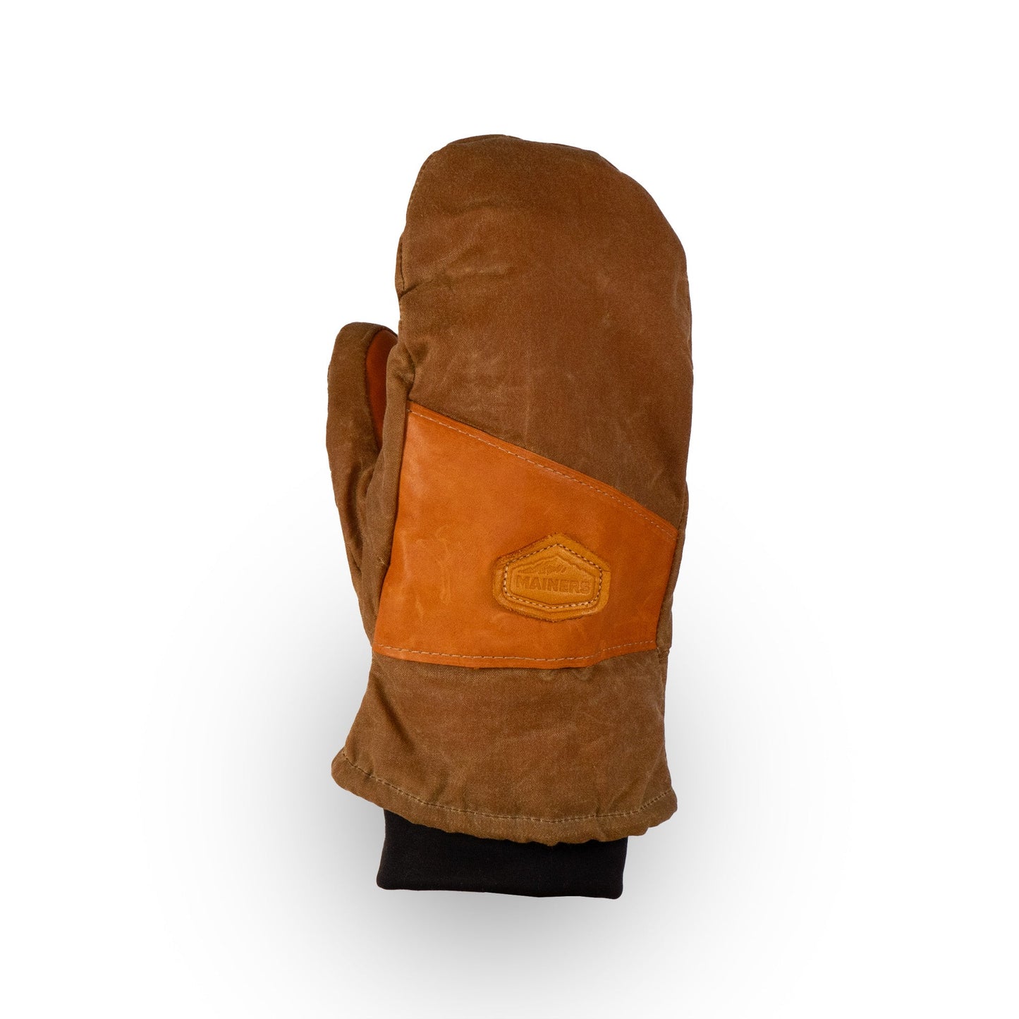 Introducing the Mainers Peaks Mitts: a ruggedly durable brown mitten featuring a leather patch on the front and a black inner cuff, ideal for any outdoor adventure. Captured against a crisp white background, these mittens are the perfect companion for your explorations.
