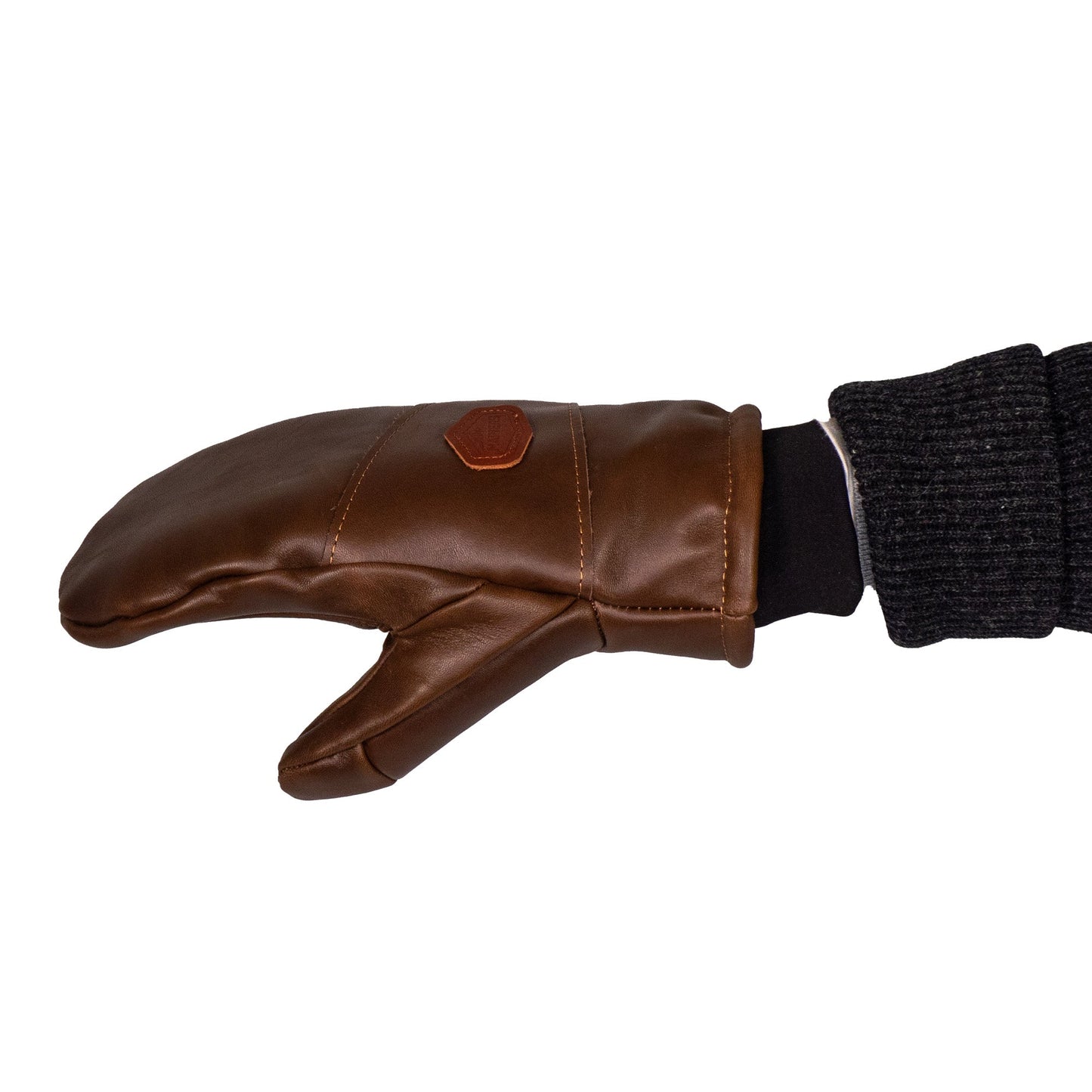 The Peaks All-Leather Mitts by Mainers, showcasing premium brown leather with a black cuff, are extended sideways on a person's hand against a white background—perfect for cold-weather excursions.