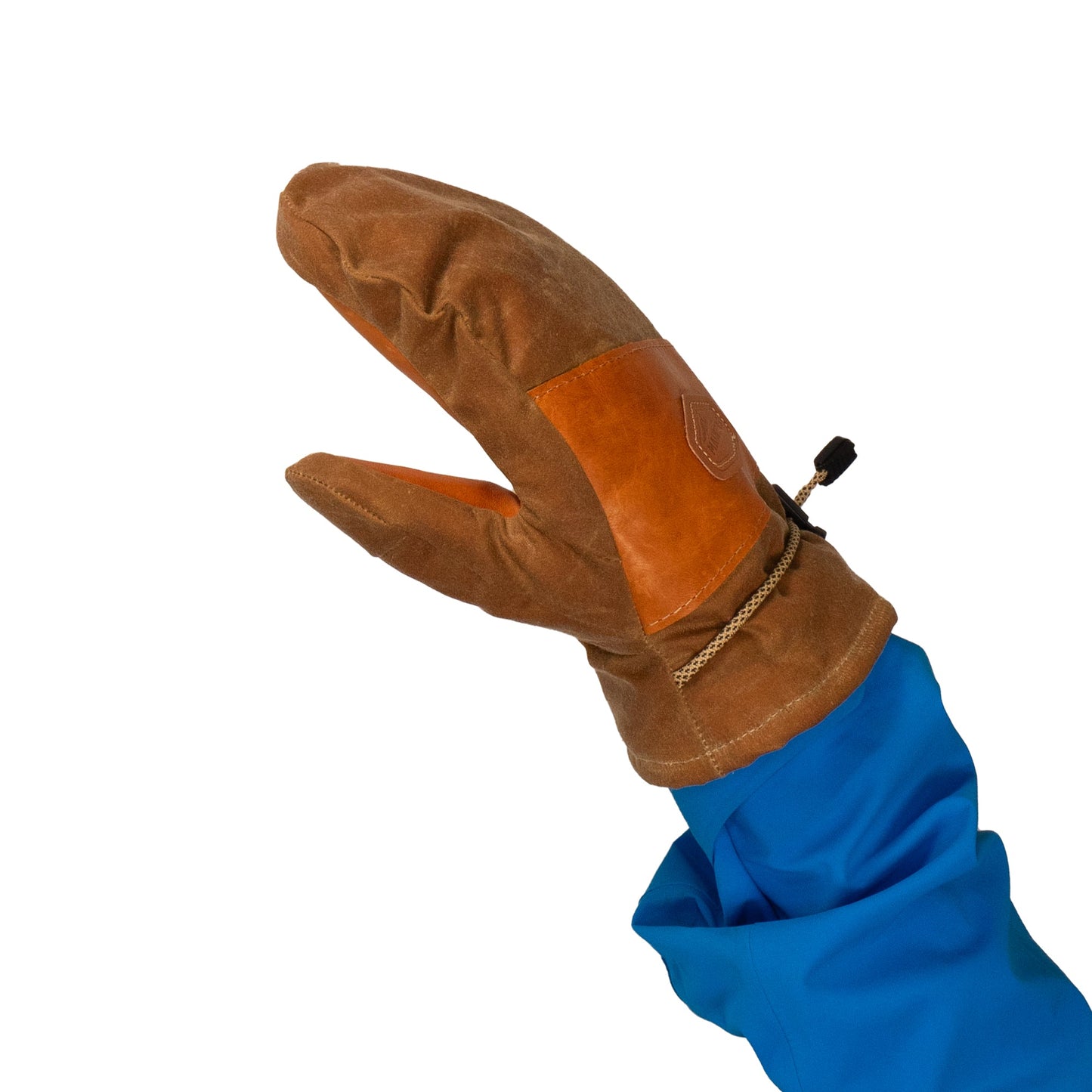 A Portland Mitt from Mainers, showcasing a leather palm and fabric blend in brown, is displayed on a hand against a white backdrop.