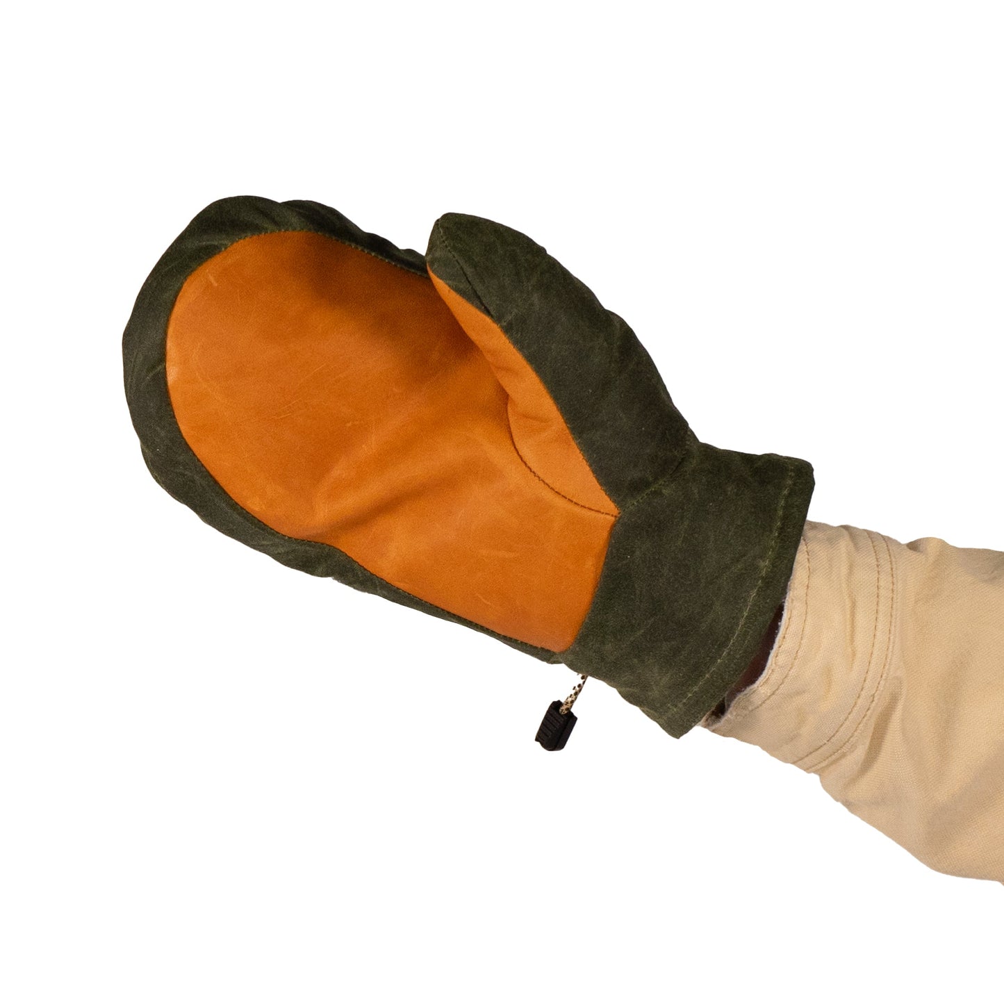 A hand adorned with a Mainers Portland Mitts, featuring a waxed canvas exterior in green and brown with a leather palm, is strikingly set against a simple white backdrop.