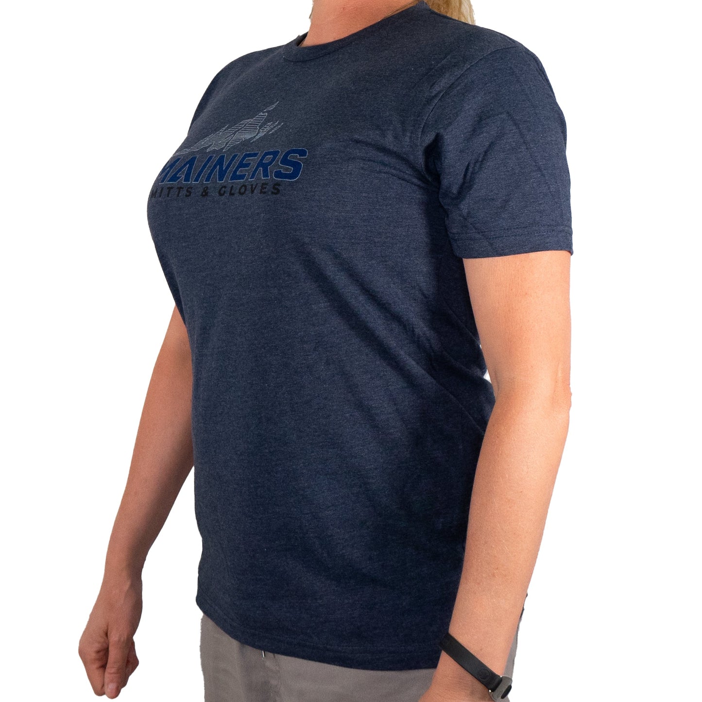Individual wearing a premium navy blue tee from Mainers, featuring the "TRAINERS BATS & GLOVES" text, posed against a plain white background.