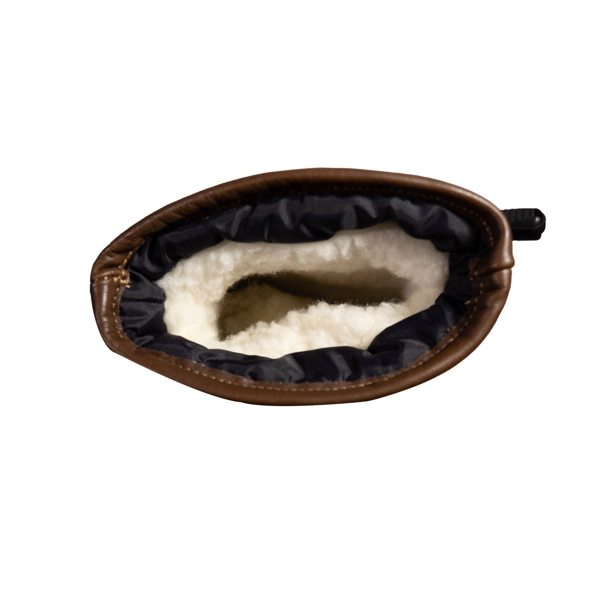 An aerial view reveals the craftsmanship of the Portland All-Leather Mitts by Mainers, featuring a cozy white wool-pile lining.
