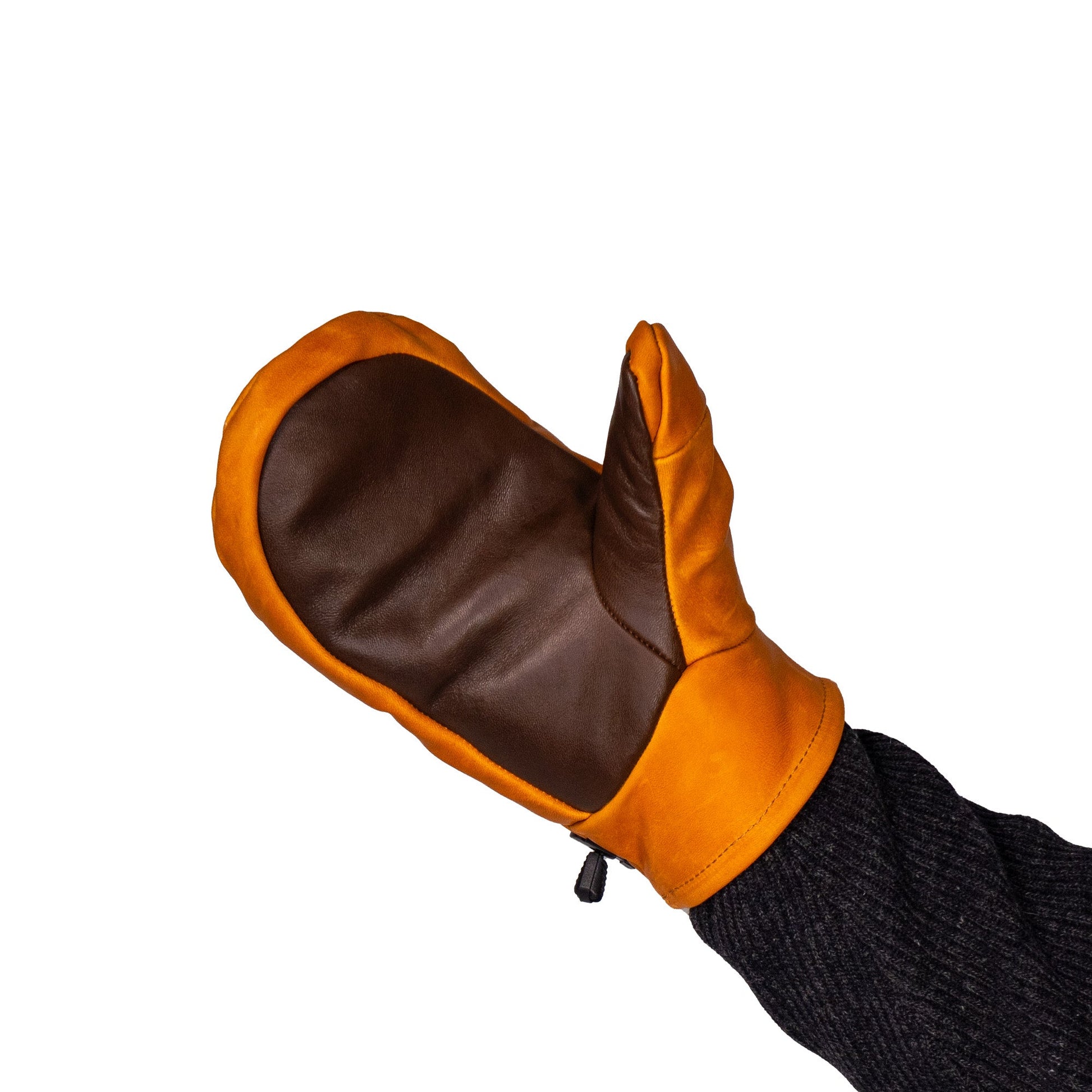 A Portland All-Leather Mitt from Mainers, featuring exceptional craftsmanship and designed in orange and brown leather, is displayed on a person's hand against a white background.