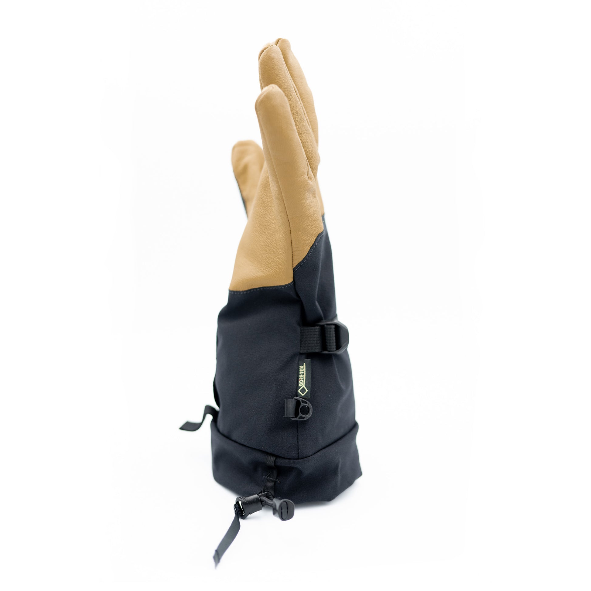 A black and tan Mainers Rangeley Glove on a white background.