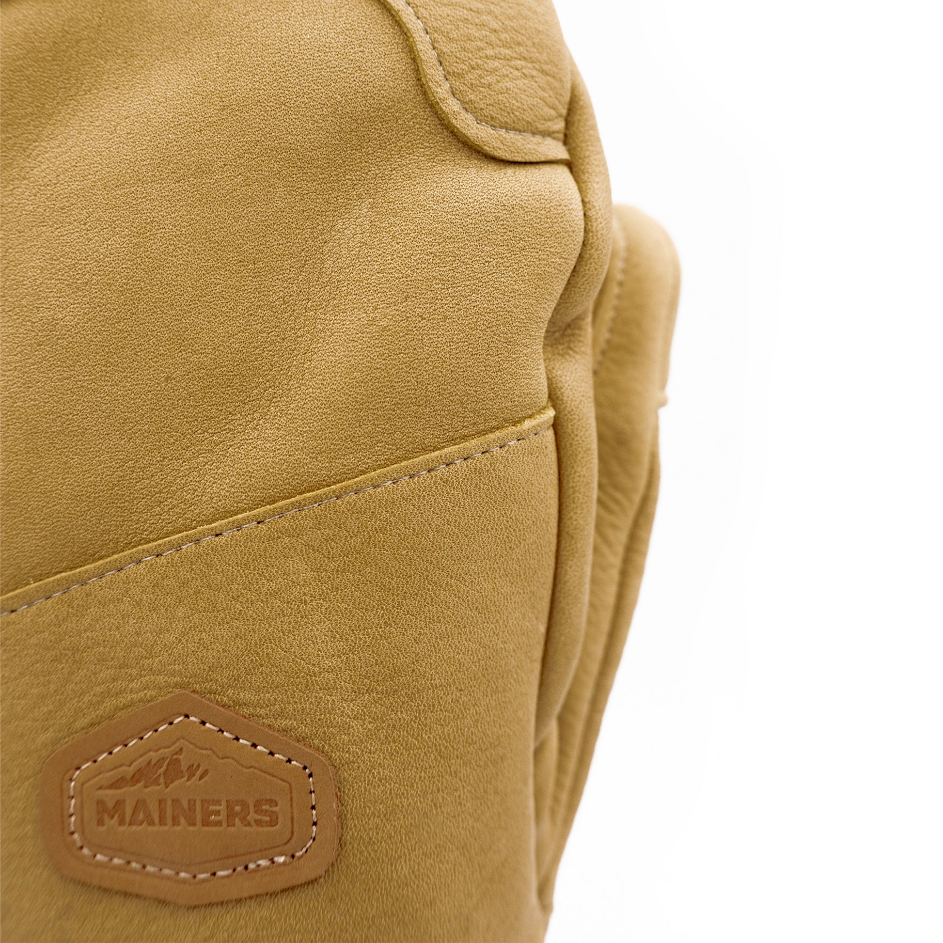 A tan Mainers leather glove with a logo on it, embodying Maine's spirit.