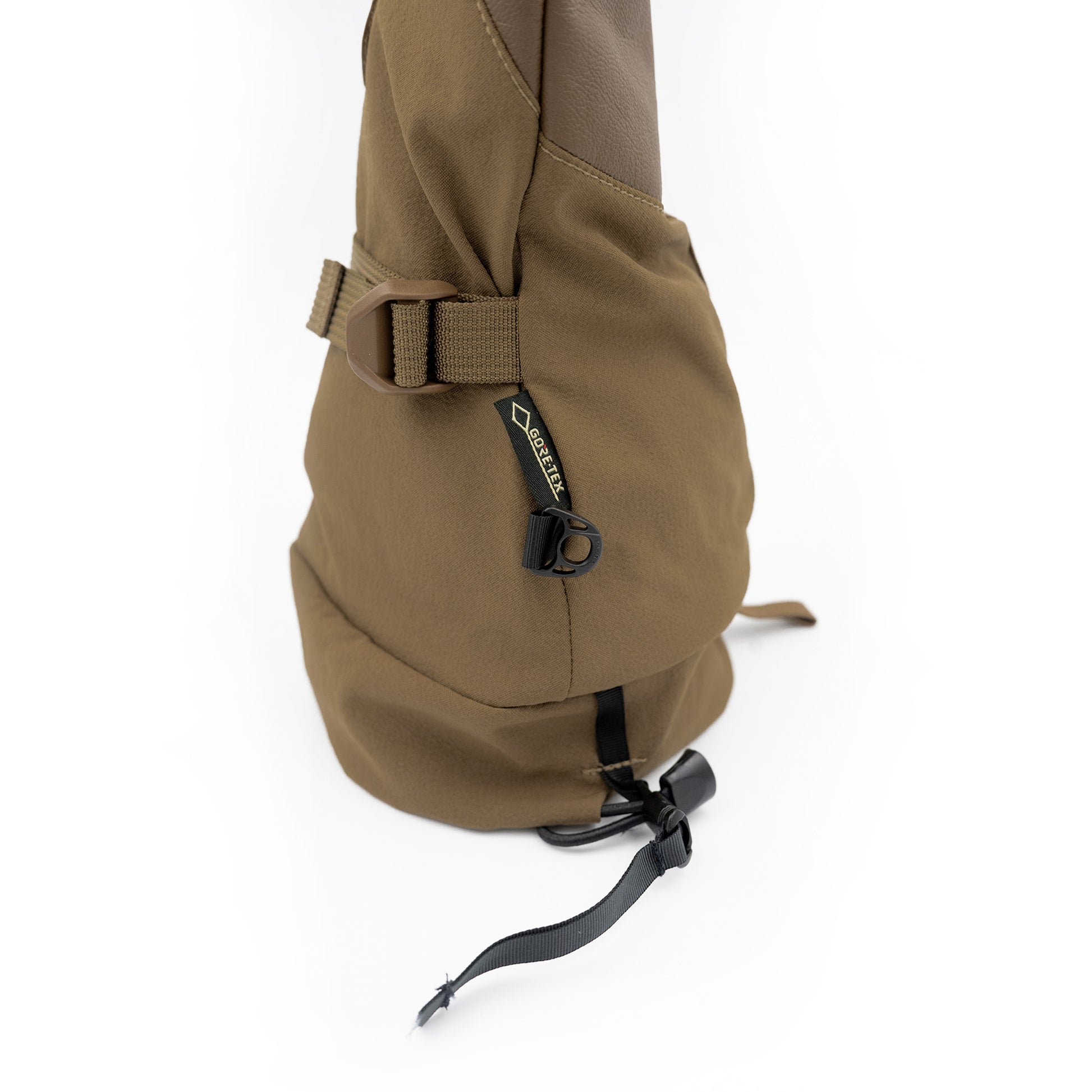 A brown Mainers Rangeley Glove bag with a strap.