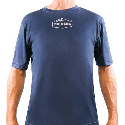 A man wearing a Mainers Sport Tee, a blue shirt.