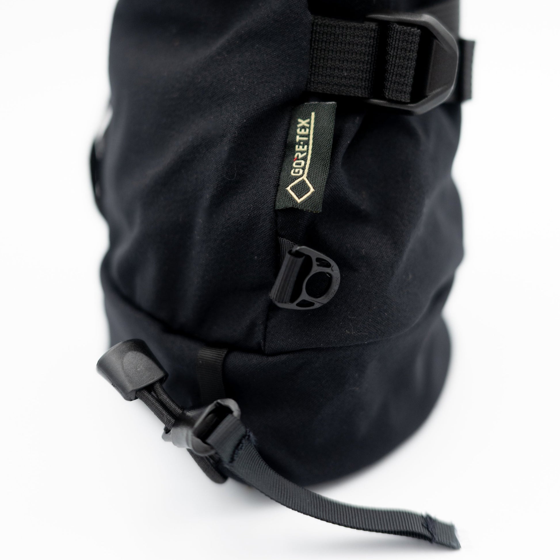 A black Rangeley Glove backpack with a strap attached to it, perfect for Maine adventures.
