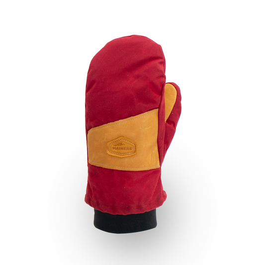 Red and tan mitten on a white background