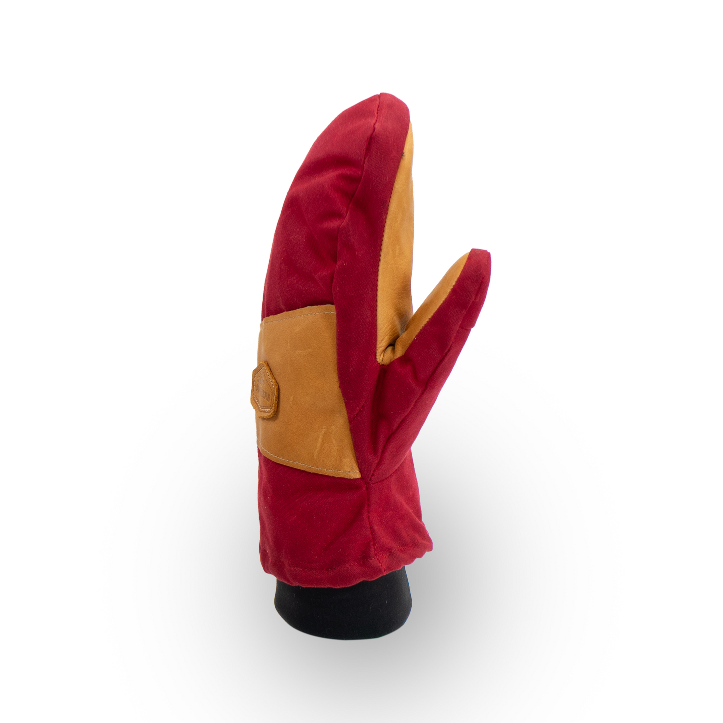 Red and tan mitten on a white background